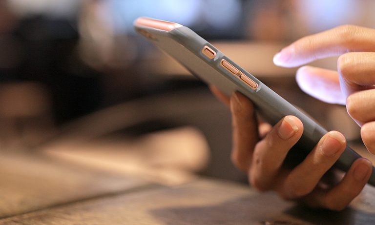 Female Hands Holding Phone